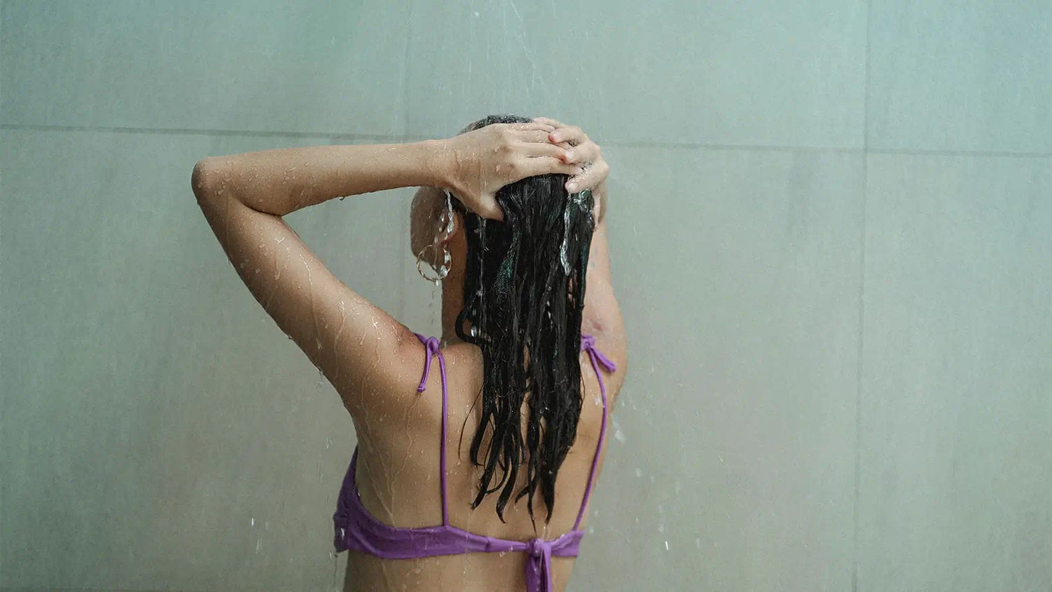 Swimmer preparing hair care routine before swimming in a pool