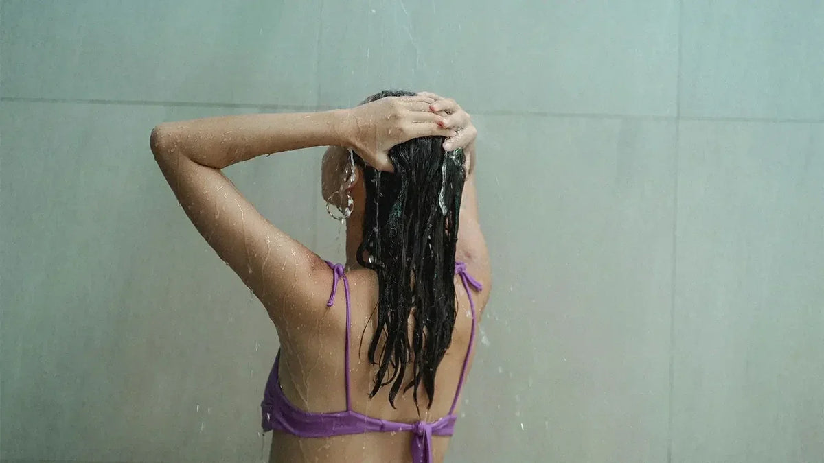 Swimmer preparing hair care routine before swimming in a pool
