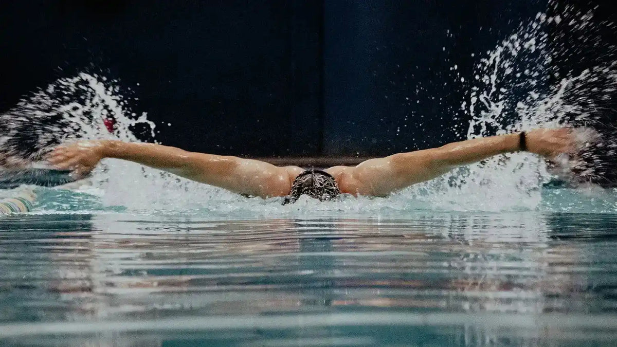 Swimmer training underwater during a pool workout