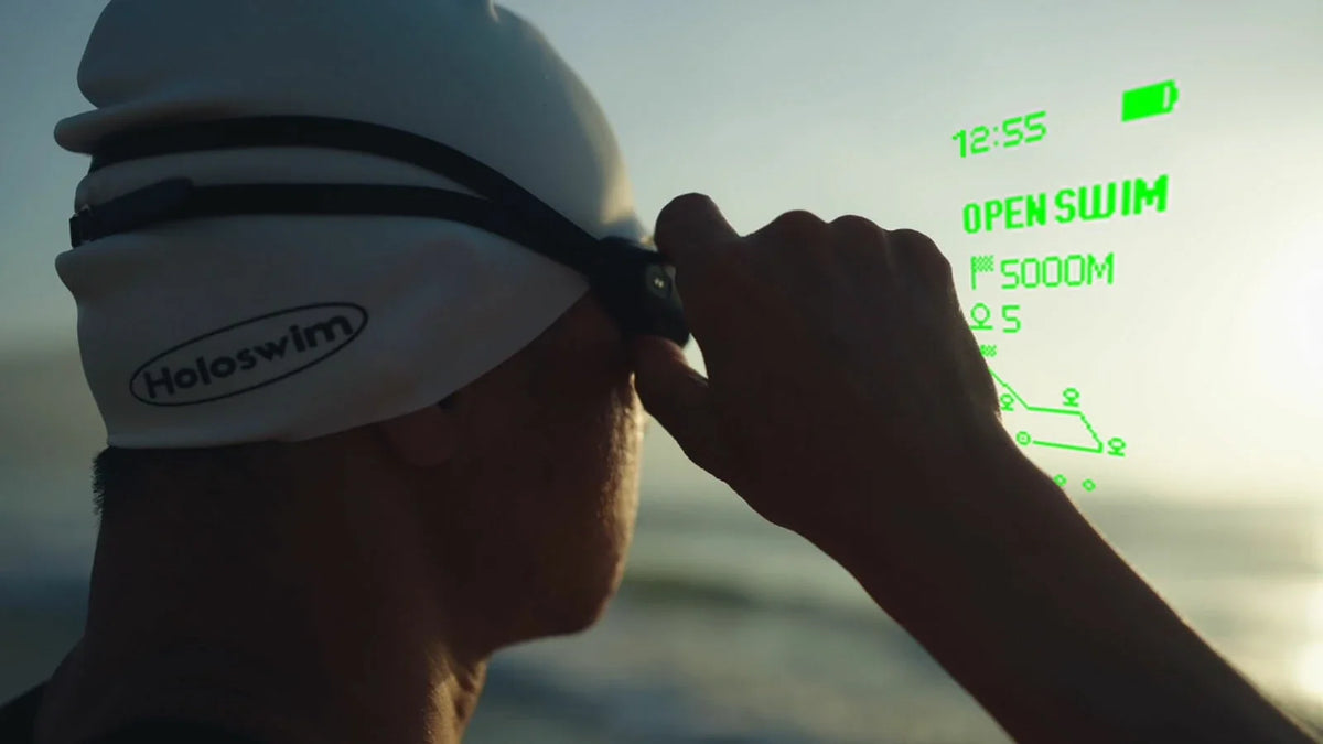 Swimmer adjusting HoloSwim 3 Pro before an open-water Route Navigation workout