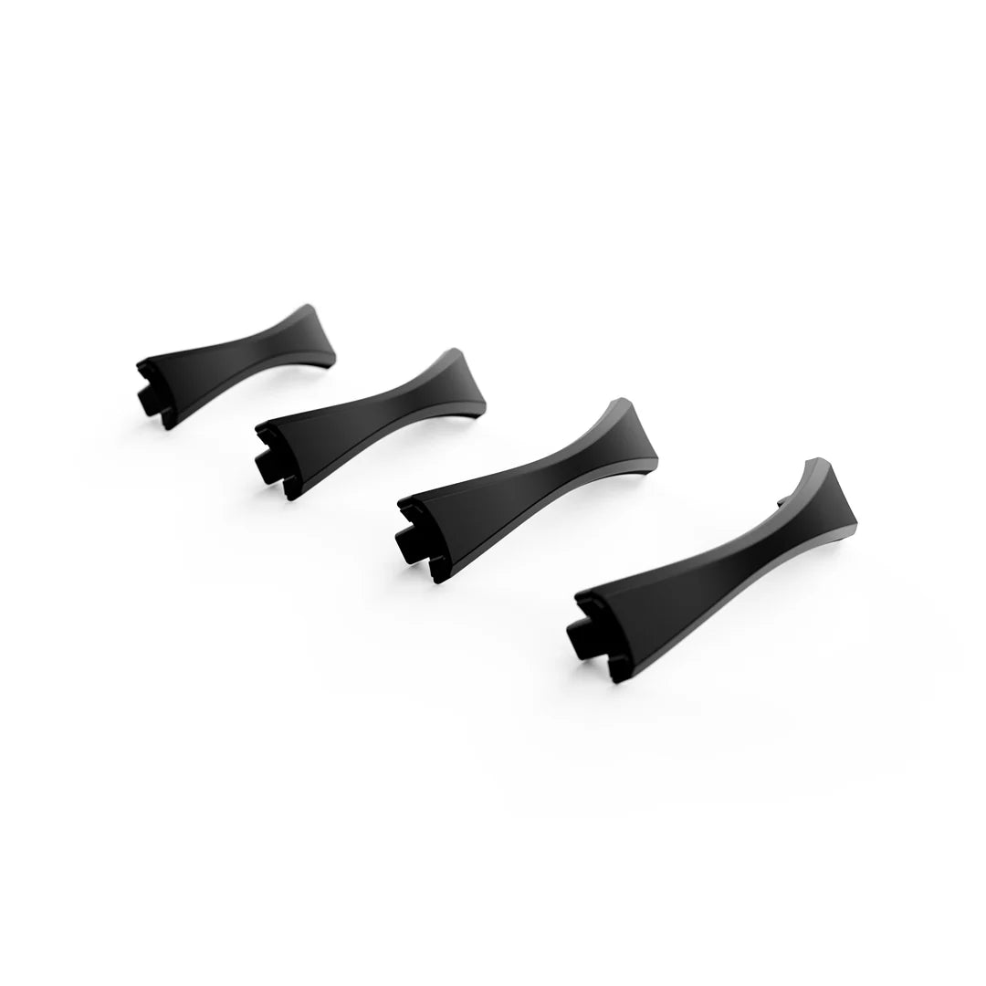 Four identical Holoswim Nose Bridge clips, black and curved with two prongs at one end and a smooth, glossy finish, are arranged diagonally on a white background.